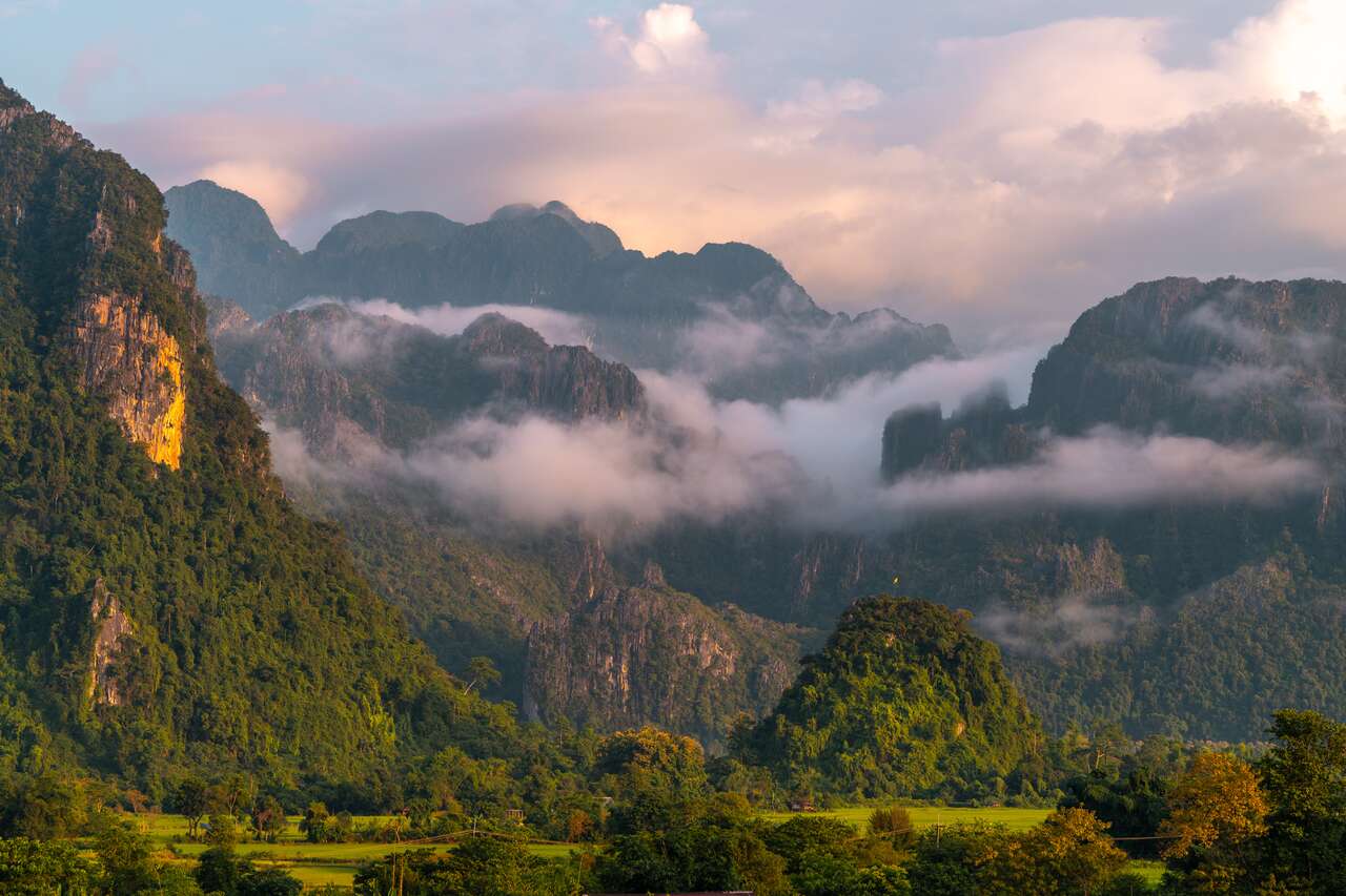 Begin your safe travel day with Vang Vieng’s tranquil ambiance